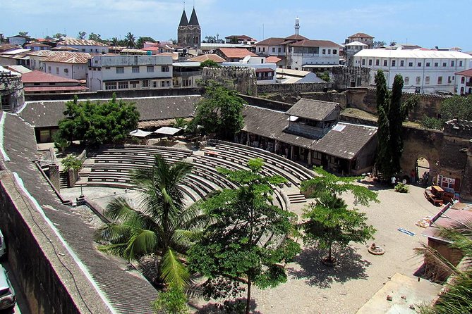Stone Town Zanzibar 2026 UNESCO coral stone lanes carved wooden doors waterfront
